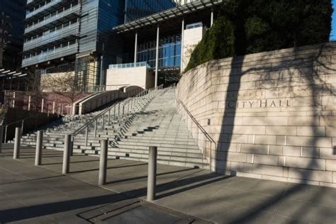 the outside of Seattle City Hall with steps leading up to the doors